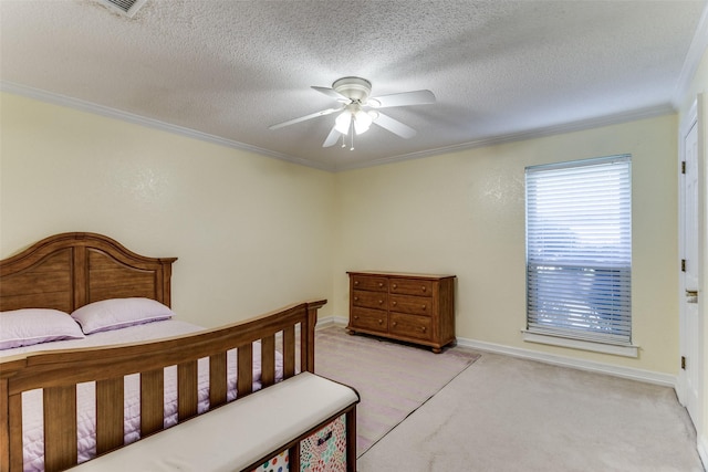 bedroom featuring ceiling fan, light colored carpet, ornamental molding, and a textured ceiling