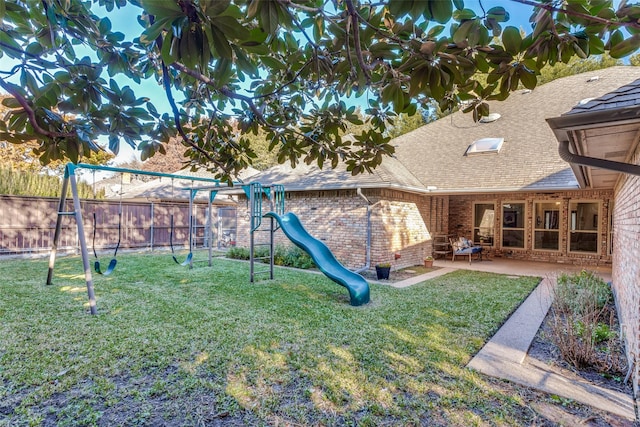 view of yard with a playground and a patio