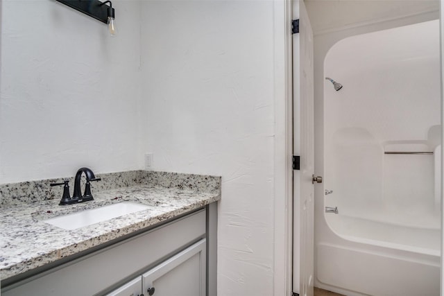 bathroom featuring vanity and washtub / shower combination