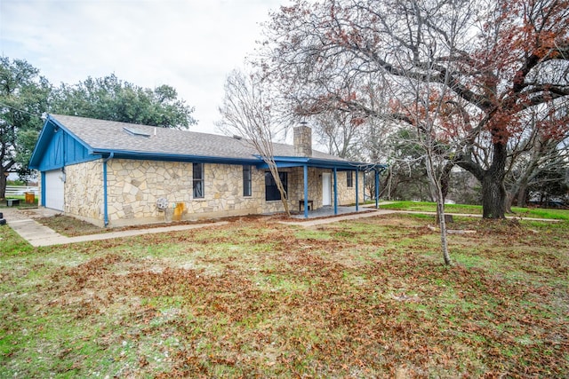 back of property featuring a garage and covered porch