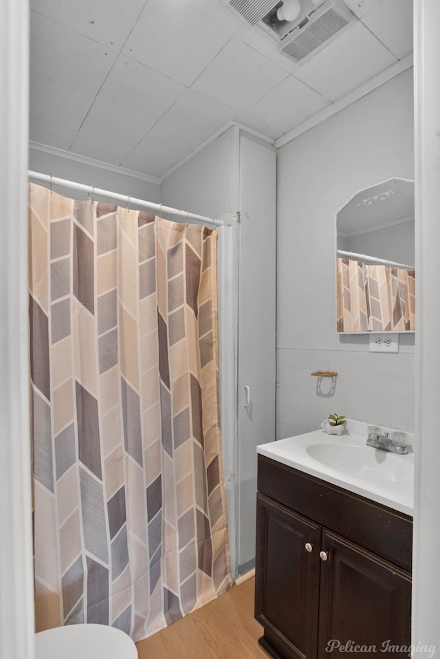 bathroom featuring vanity and hardwood / wood-style floors