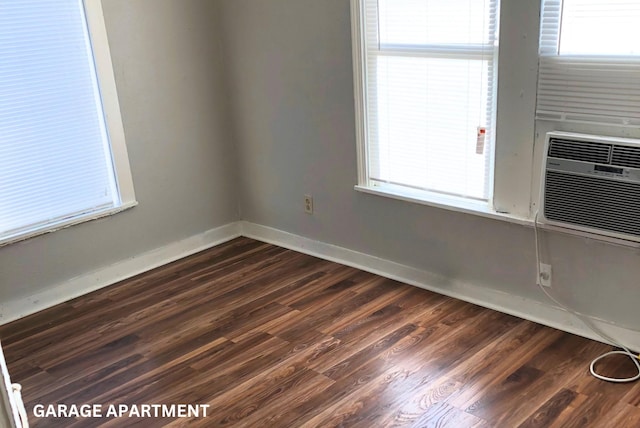 unfurnished room with dark hardwood / wood-style floors