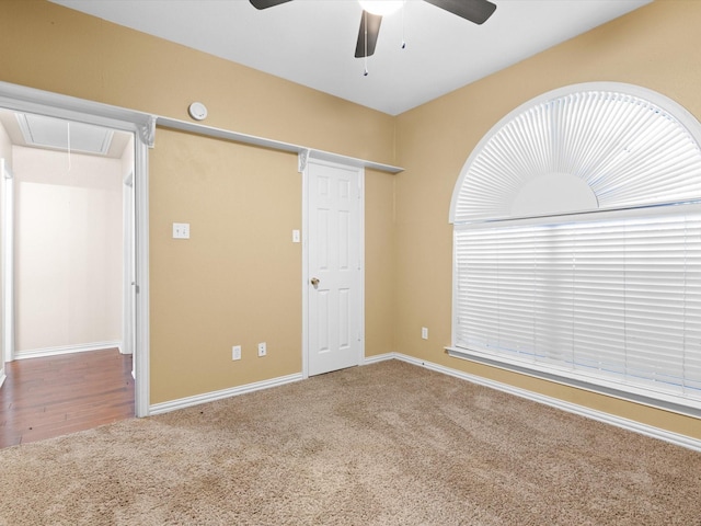 unfurnished bedroom featuring carpet and ceiling fan