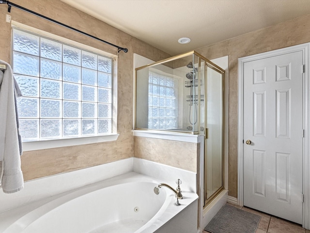 bathroom with tile patterned flooring and plus walk in shower