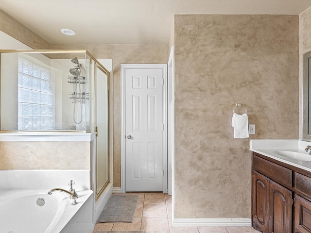 bathroom featuring tile patterned floors, separate shower and tub, and vanity