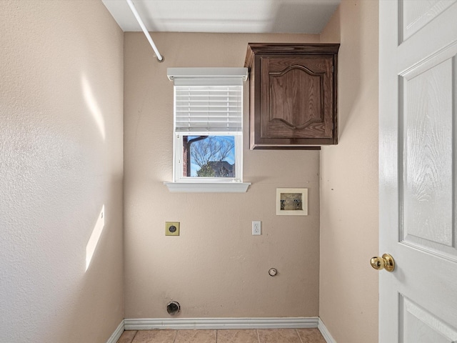 laundry room with hookup for an electric dryer, hookup for a washing machine, hookup for a gas dryer, and cabinets