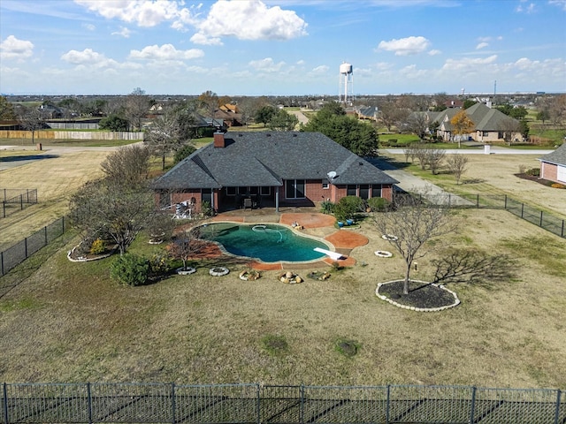 view of swimming pool featuring a lawn and a patio area