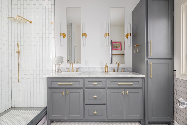 bathroom with vanity and tiled shower