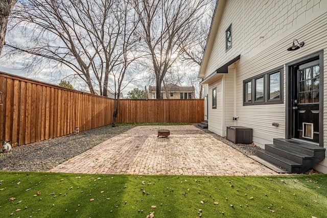 view of yard featuring an outdoor fire pit and a patio area