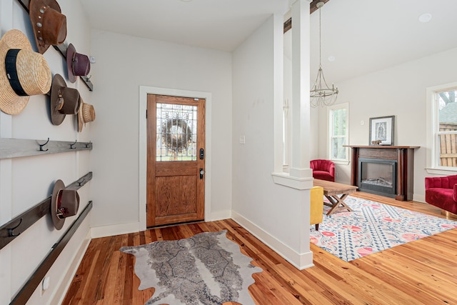 entryway featuring a notable chandelier and hardwood / wood-style flooring