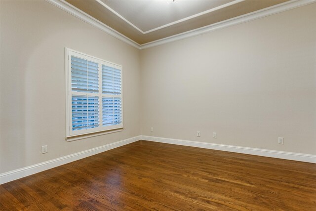 spare room with hardwood / wood-style flooring and ornamental molding