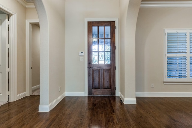 entryway featuring dark hardwood / wood-style floors and ornamental molding