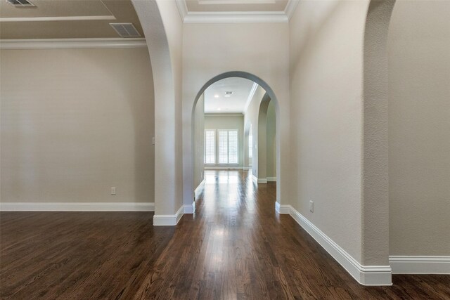 hall with dark hardwood / wood-style floors and ornamental molding