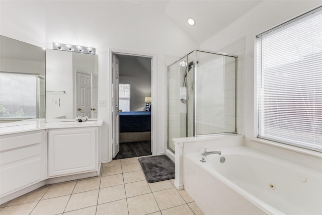 bathroom with tile patterned floors, vanity, lofted ceiling, and shower with separate bathtub