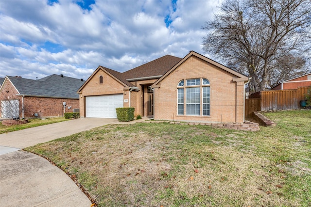 view of front of house featuring a front yard and a garage