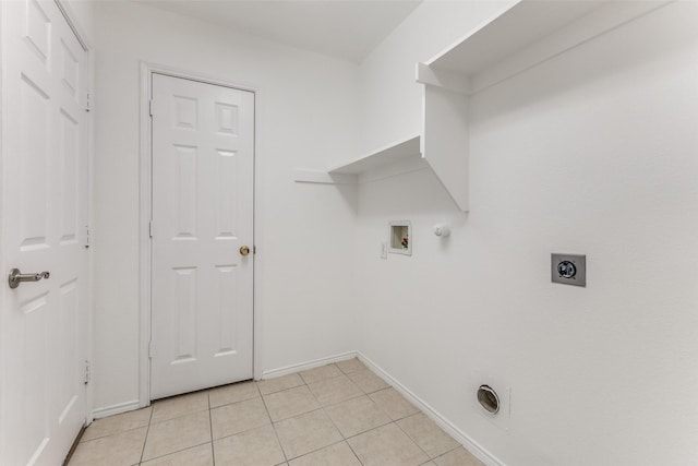 washroom with electric dryer hookup, hookup for a gas dryer, light tile patterned floors, and washer hookup