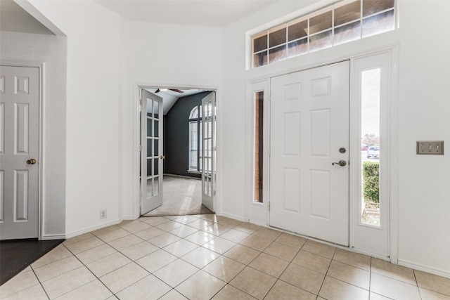 entryway with light tile patterned floors