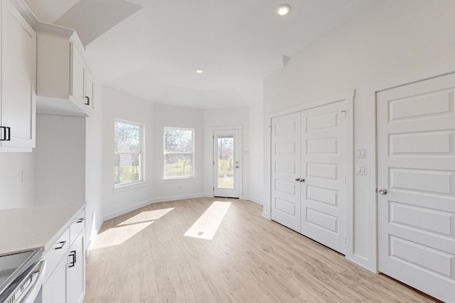 unfurnished bedroom featuring a closet and light wood-type flooring