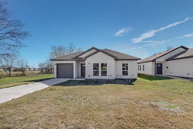 view of front facade with a front yard and a garage