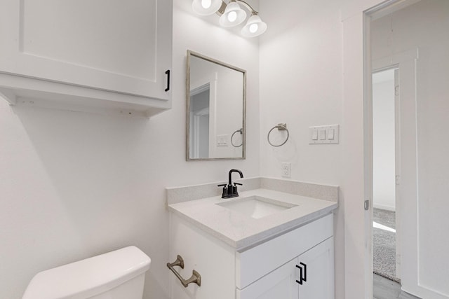 bathroom with vanity and toilet