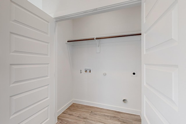 laundry area with hookup for an electric dryer, washer hookup, light hardwood / wood-style floors, and gas dryer hookup