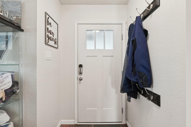 entryway with a textured ceiling