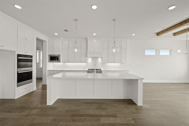 1604 Rolling Oaks Dr, Fort Worth, TX 76008 - kitchen with double oven, stainless steel microwave, white cabinets, recessed lighting, and a large island with sink