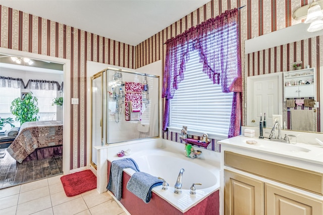 bathroom featuring wallpapered walls, a shower stall, a bath, ensuite bath, and tile patterned floors