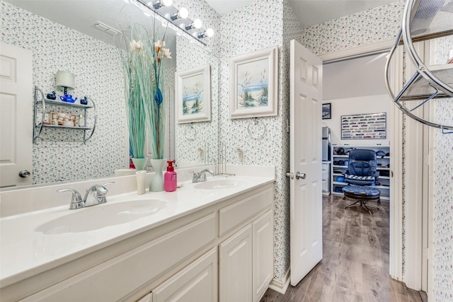 bathroom with vanity and hardwood / wood-style floors