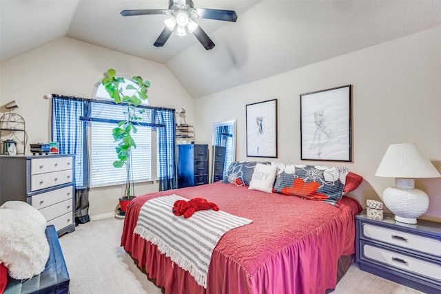 bedroom featuring lofted ceiling, a ceiling fan, and light colored carpet