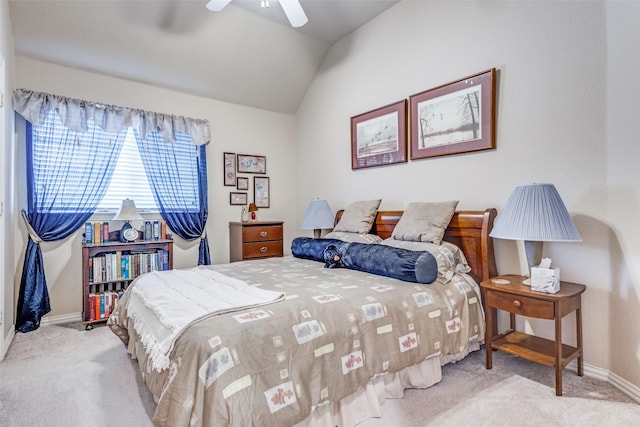 carpeted bedroom with vaulted ceiling and ceiling fan