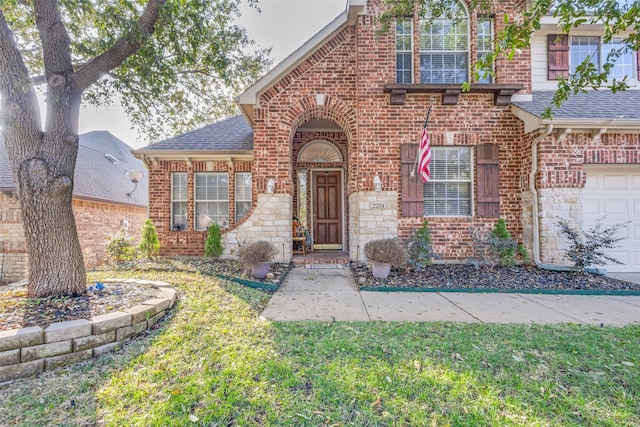 view of front facade with a garage and a front yard