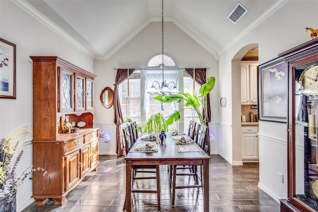 dining space featuring lofted ceiling, arched walkways, a chandelier, dark wood-style flooring, and visible vents