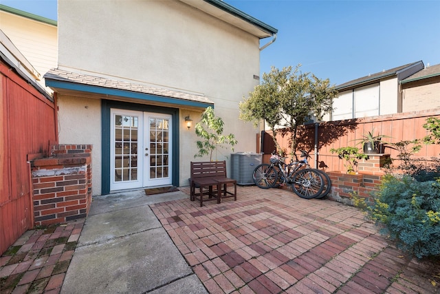 view of patio / terrace featuring central AC unit and french doors