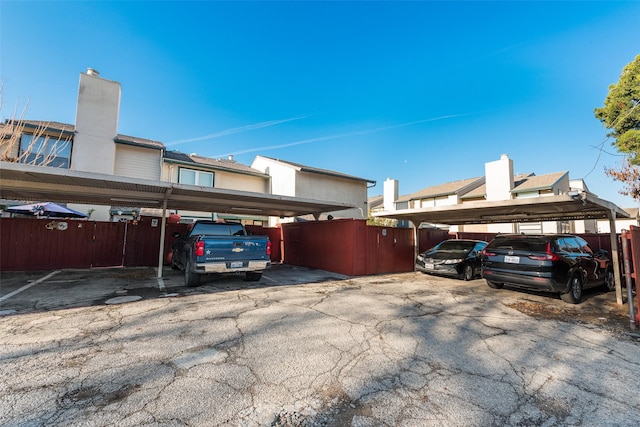 view of parking / parking lot featuring a carport