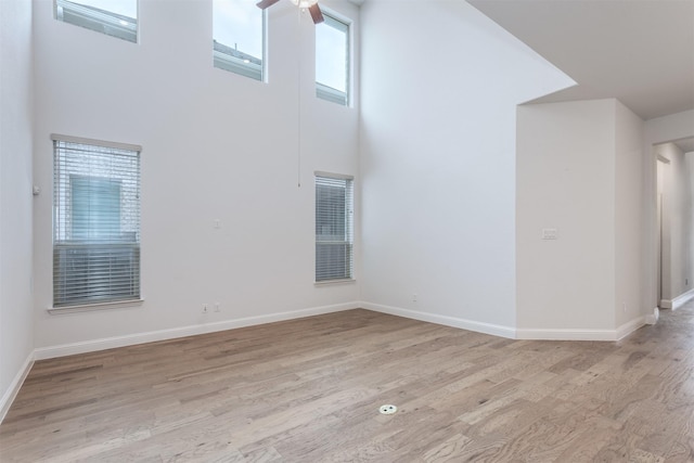 empty room featuring a healthy amount of sunlight and light wood-type flooring