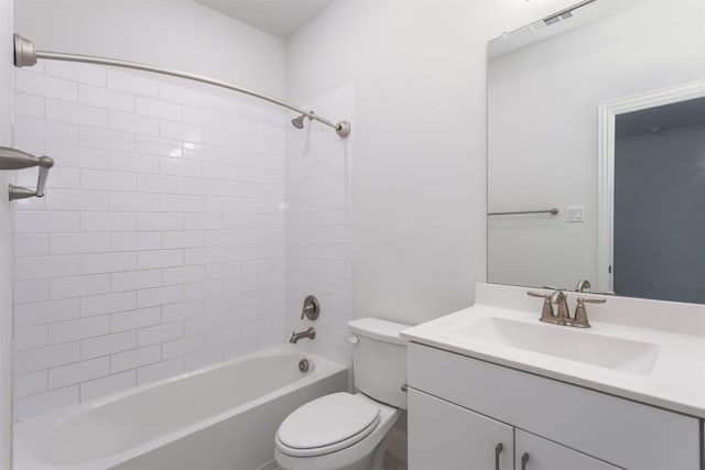 full bathroom with vanity, toilet, and tiled shower / bath combo