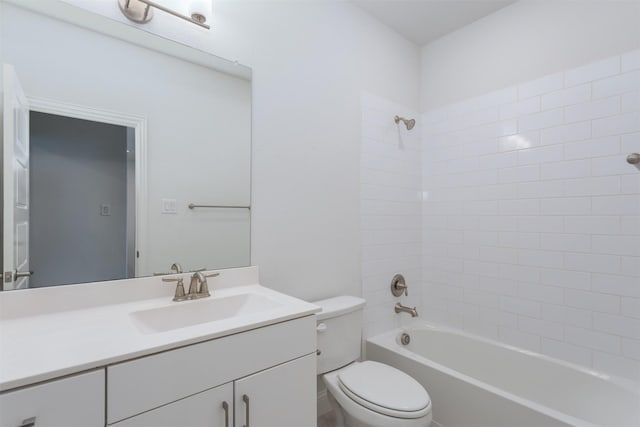 full bathroom featuring vanity, toilet, and tiled shower / bath combo