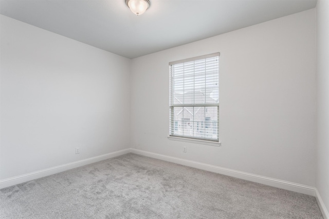 unfurnished room with carpet flooring