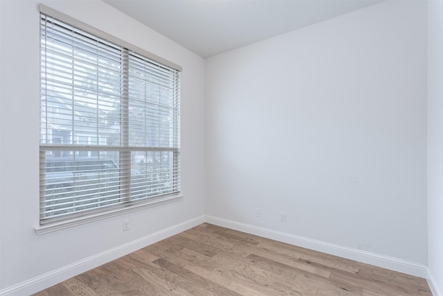 unfurnished room featuring light hardwood / wood-style flooring