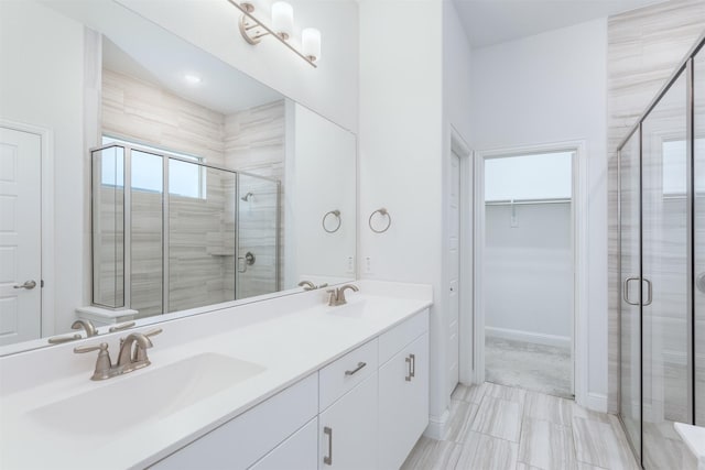 bathroom with vanity and an enclosed shower