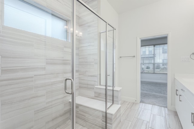 bathroom with vanity and an enclosed shower