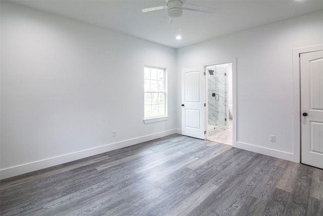 unfurnished room featuring dark hardwood / wood-style floors and ceiling fan