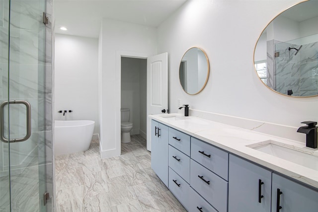 full bathroom featuring vanity, separate shower and tub, and toilet