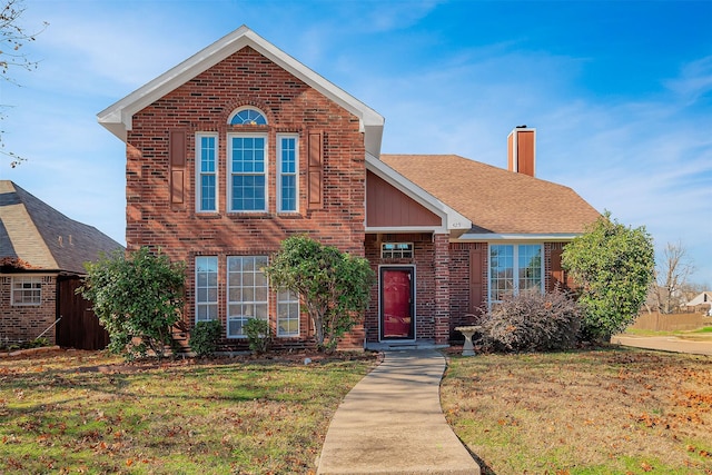 front facade featuring a front yard