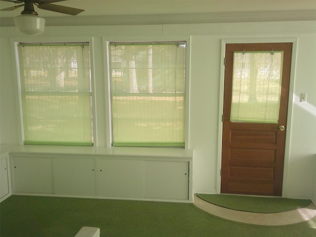 interior space featuring ceiling fan