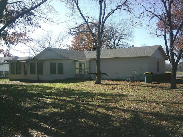 view of property exterior with a lawn