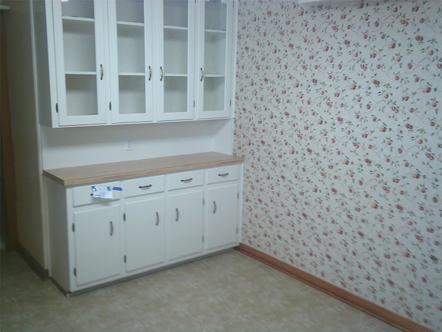 kitchen featuring white cabinetry