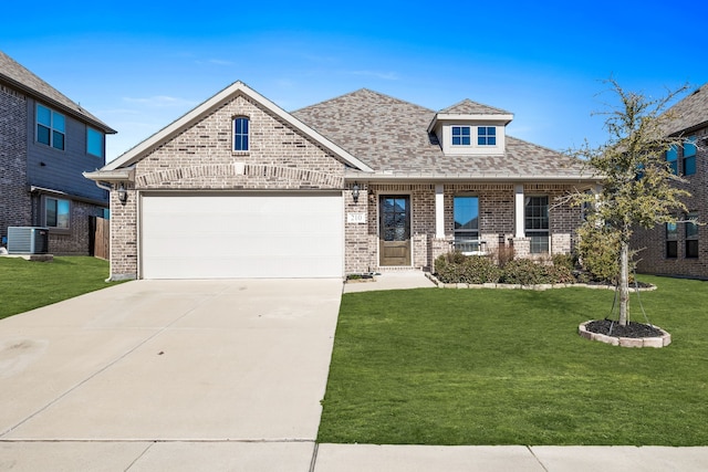 craftsman-style home with a garage, a front yard, and central AC