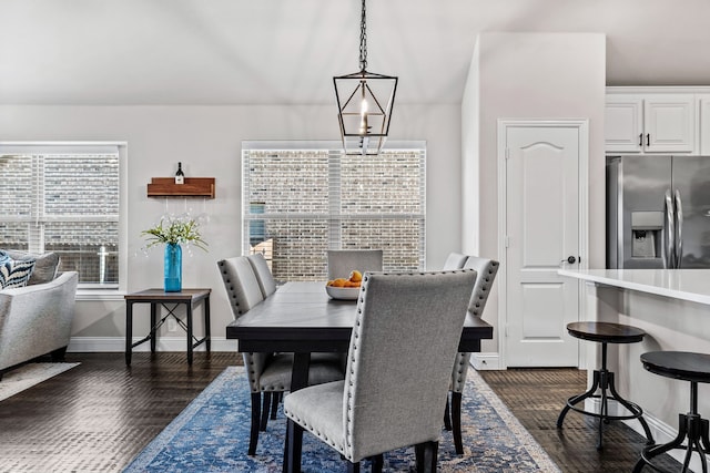 dining area featuring dark wood-type flooring